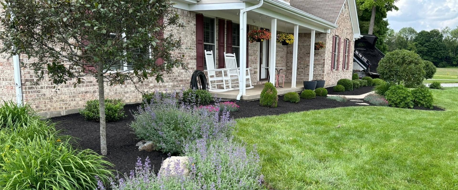 garden newly mowed with flowers and mulch 01 Zach mowing huge area